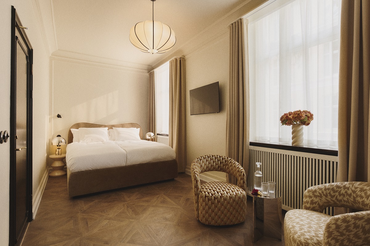 A French weave pattern on the floor offers a calmer effect, and is shown here in a guest room where the palette is neutral with plenty of natural light, it is a serene, relaxing space.