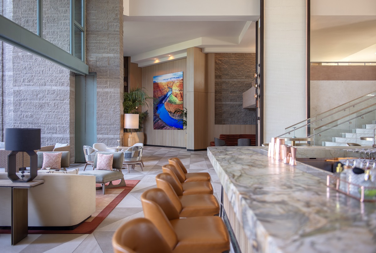 bar chairs, marble bar and sofas in hotel lobby