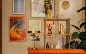 Gallery wall with brass pipe shelving in Communal space at Branch members club, by Holloway Li
