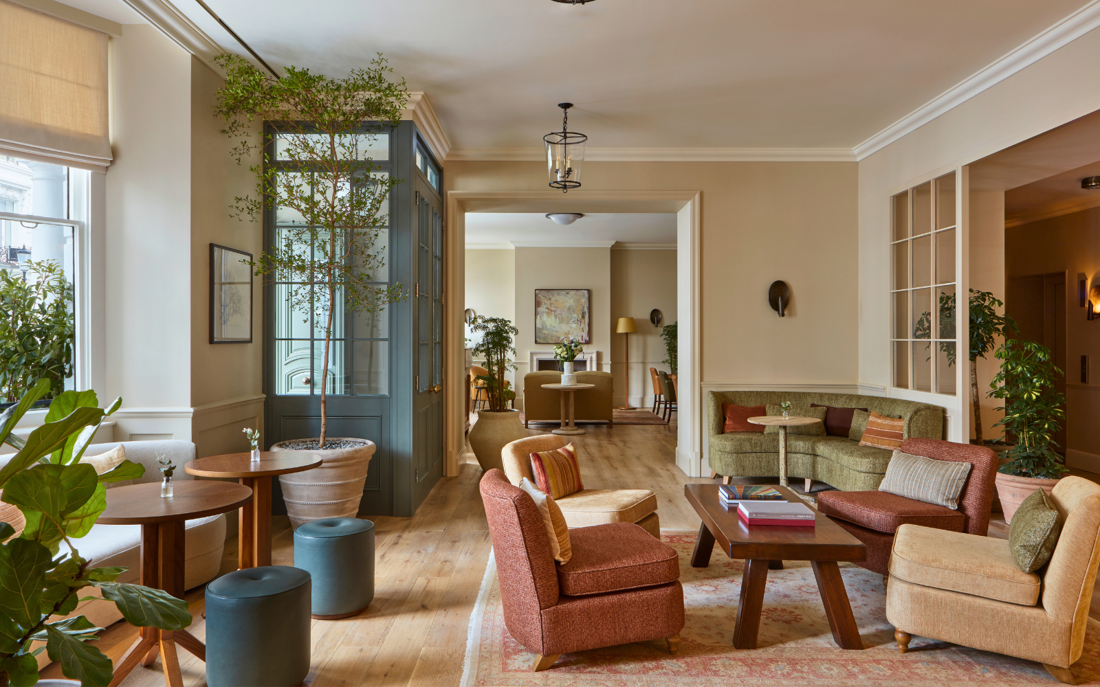 Lobby area at Templeton Garden, open plan with lots of potted foliage and soft seating areas