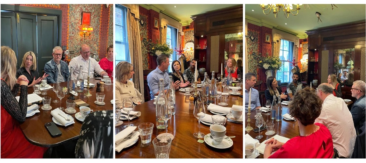 Roundtable snippet shots of the lively discussion shows guests from around the table animated in their discussions.