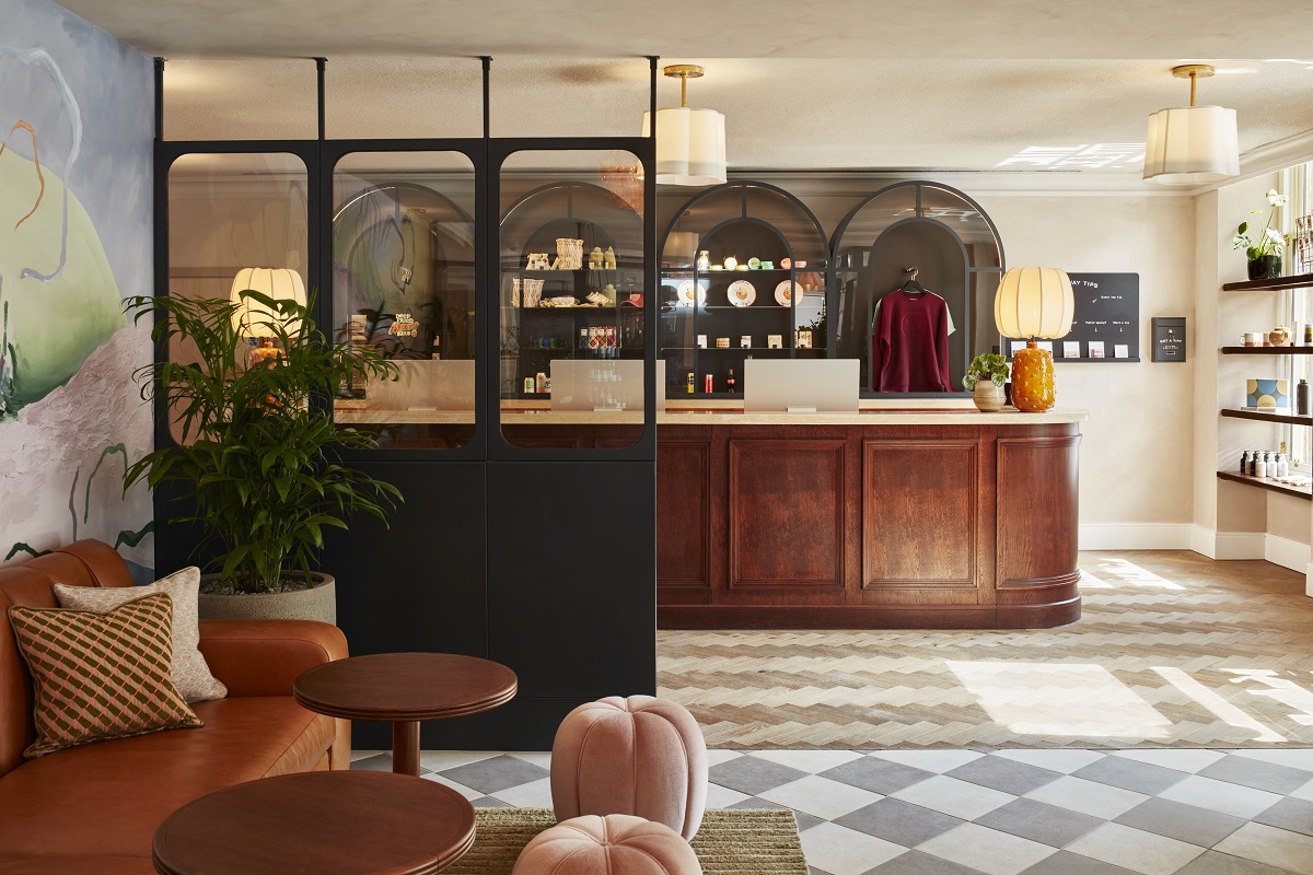 wooden front desk with chequered floor in The Hoxton Edinburgh