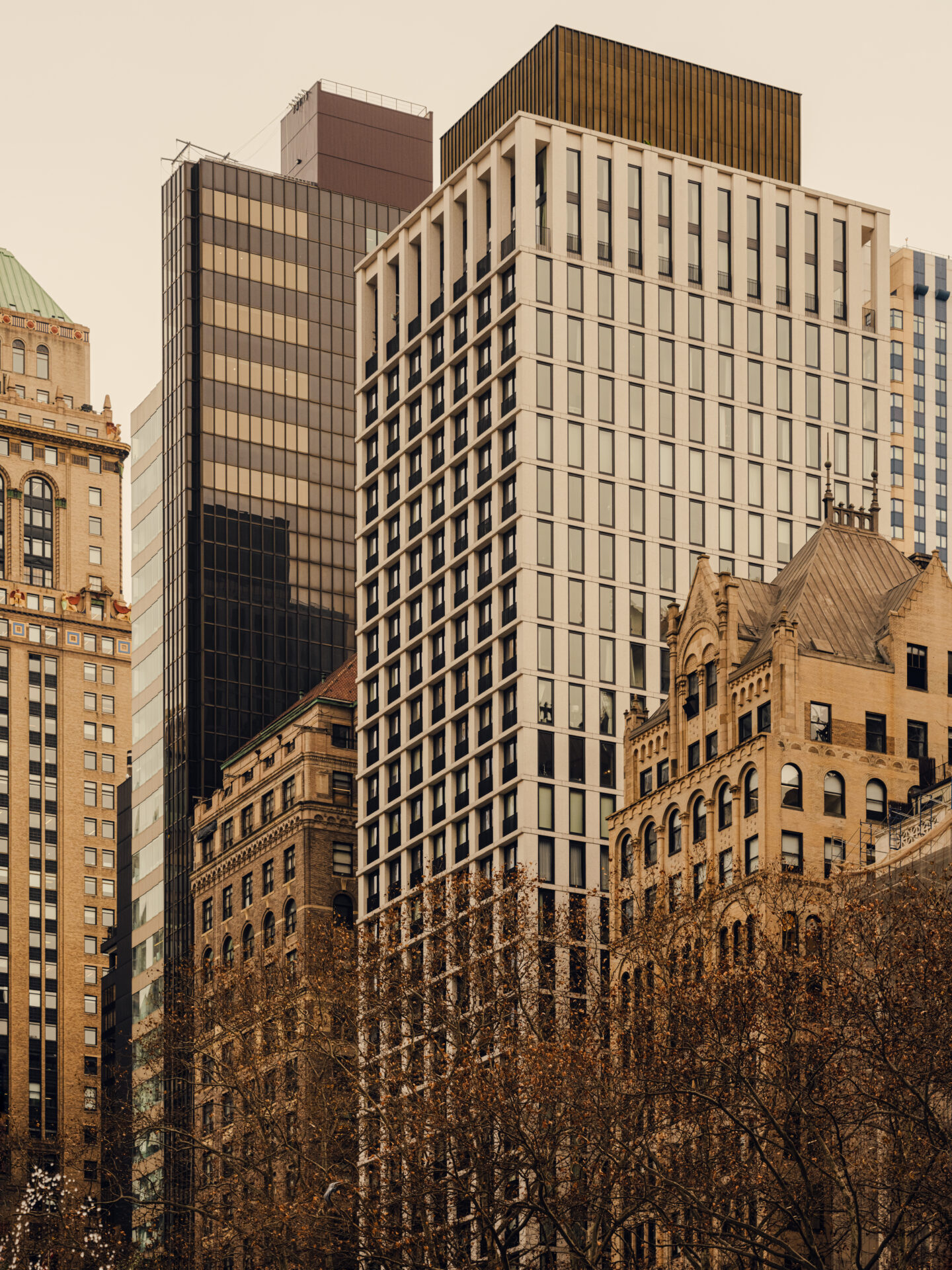 Exterior view of The Bryant building (light-coloured building in the centre), as seen from Bryant Park.