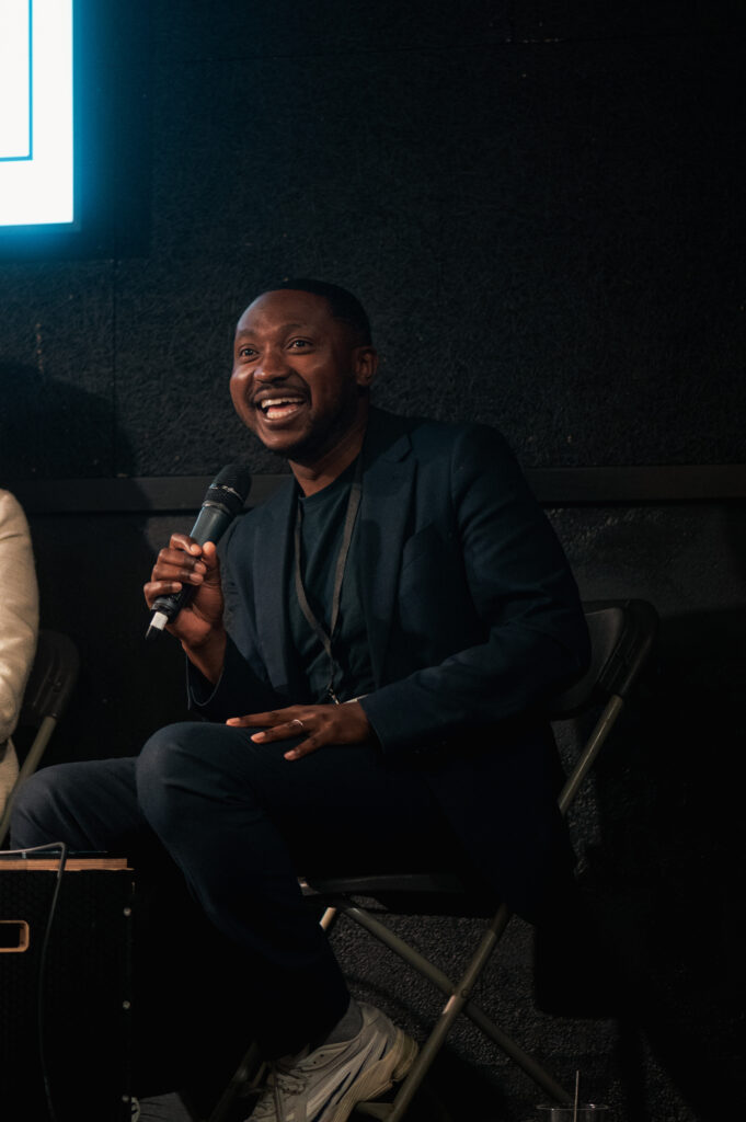 Tolu Adeko, speaker, smiling while talking