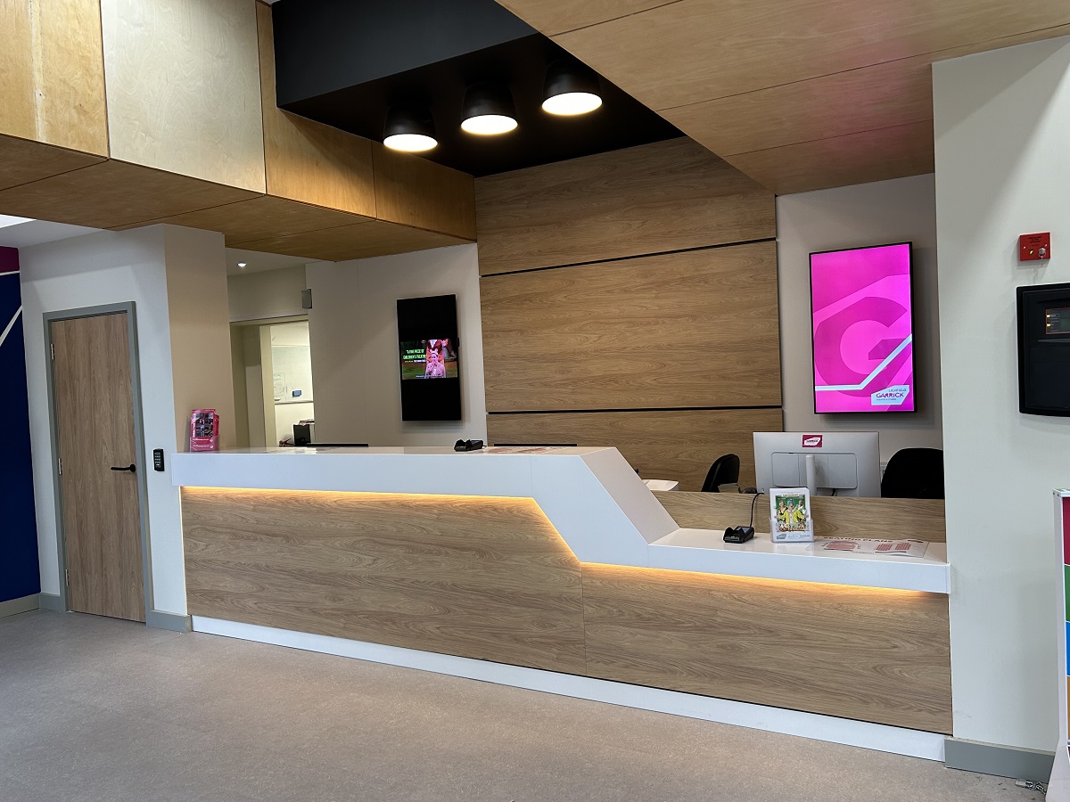 curved theatre ticket desk clad in HIMACS from James Latham