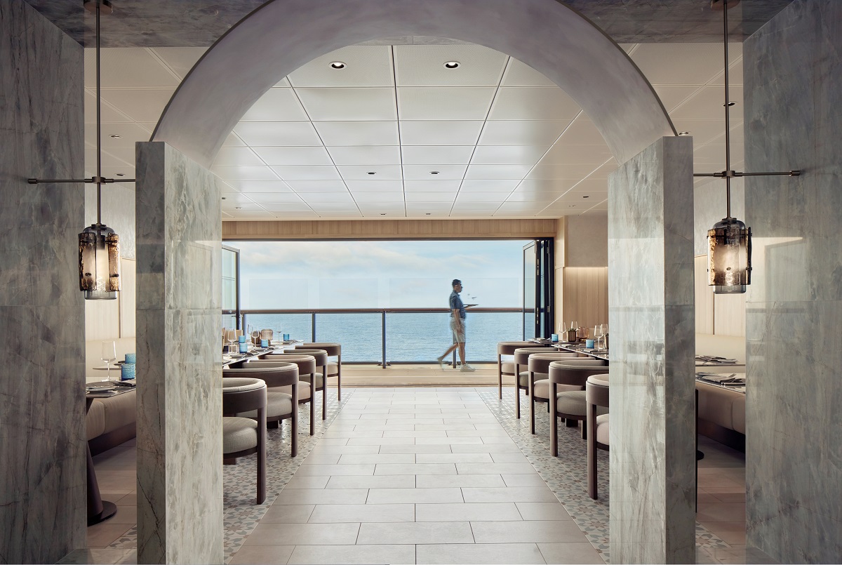view through arch into restaurant with ocean beyond on the Luminara