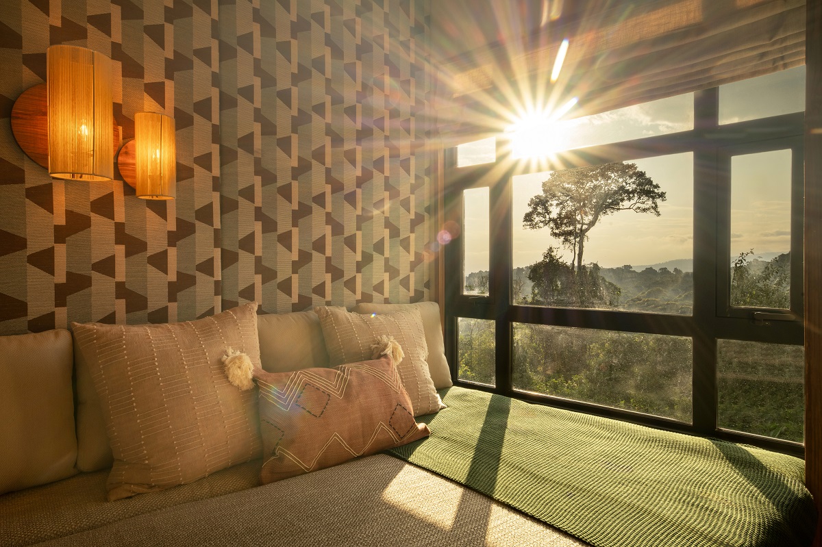 daybed in guestroom of Lemala Osonjoi Lodge with sunset view