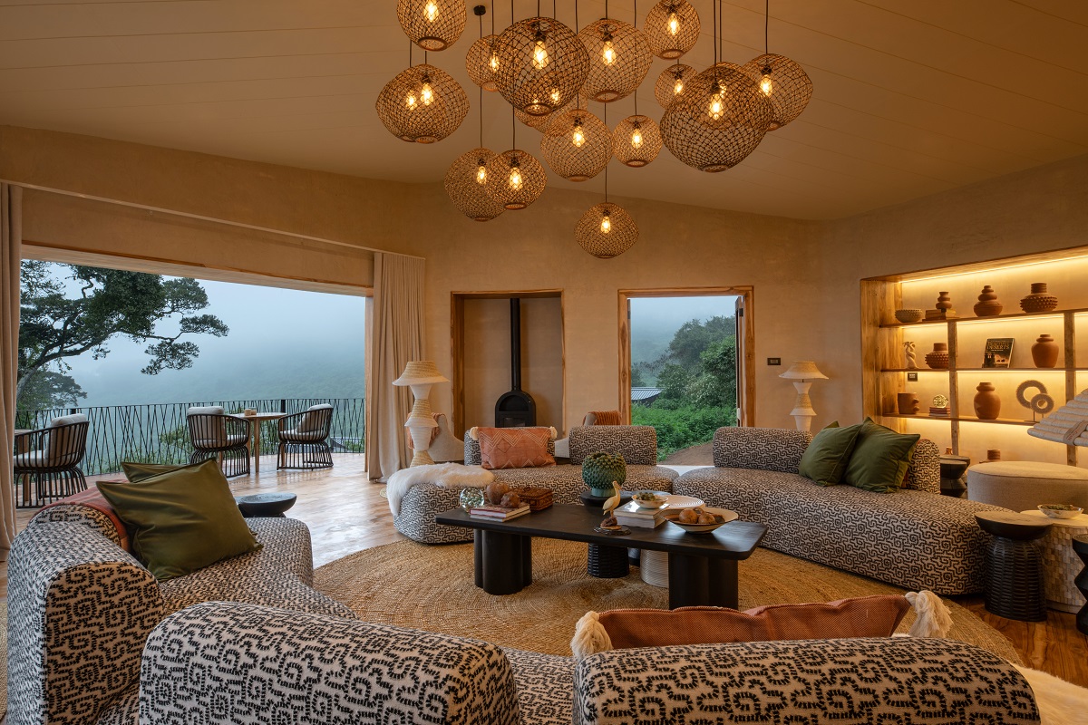 circular couches and seating looking out over misty view at Lemala Osonjoi Lodge