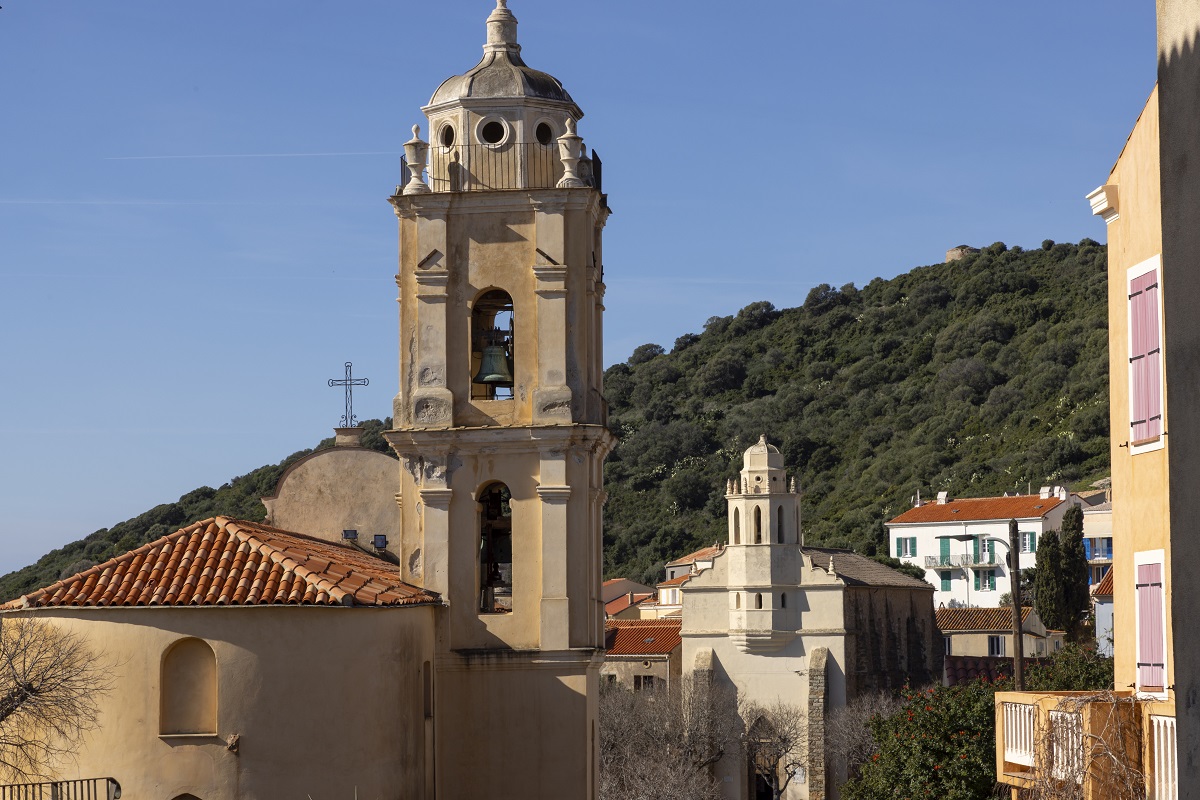 two churches, facing each other above the sea in village in corsica