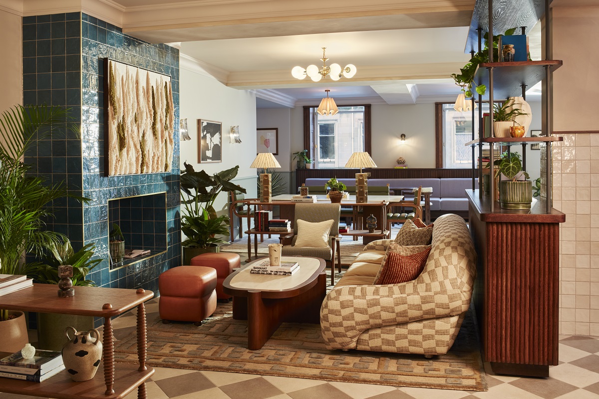 tiled wall, mid century furniture, shelves and plants in the hotel lobby
