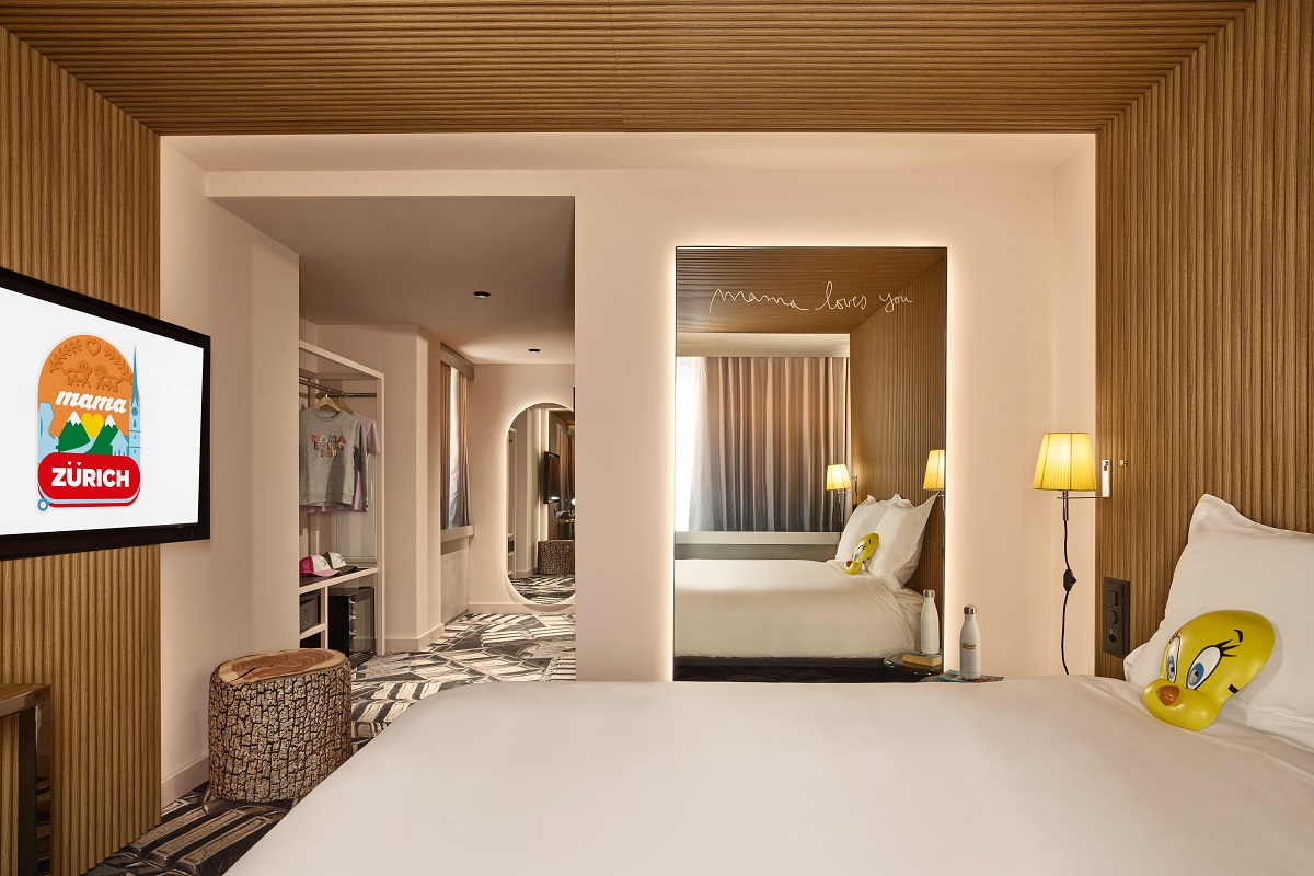 guestroom in Mama Shelter Zurich with trademark mask on the bed