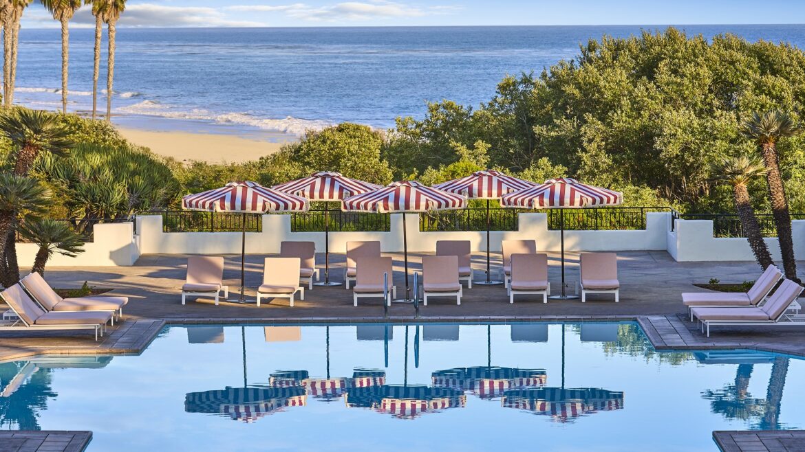 sea view and pool detail with red and white striped umbrellas at The Ritz-Carlton Bacara, Santa Barbara