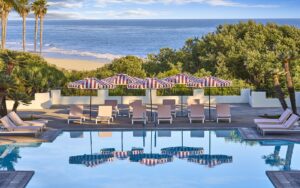 sea view and pool detail with red and white striped umbrellas at The Ritz-Carlton Bacara, Santa Barbara