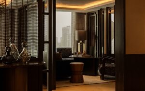 Rosewood doha seating space in clubhouse lounge with view across Doha