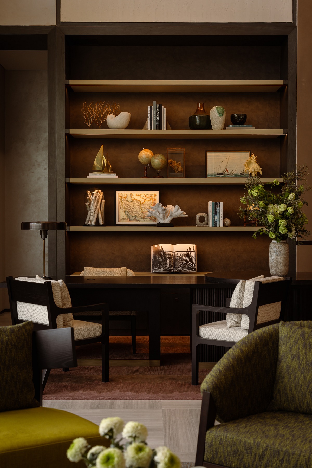 bookshelves and seating in public spaces of Rosewood Doha