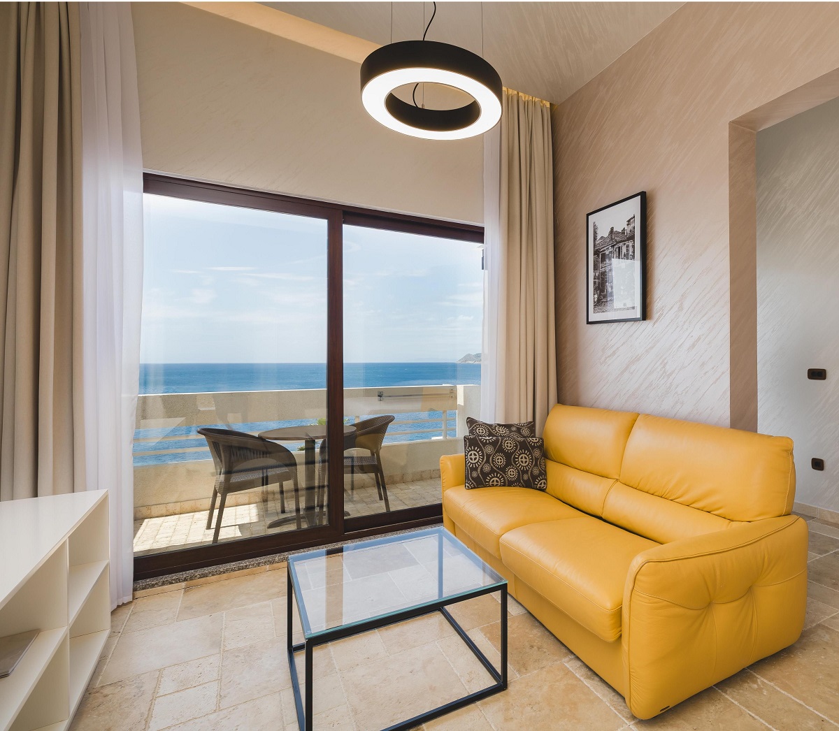 yellow couch in guestroom at Radisson Montenegro