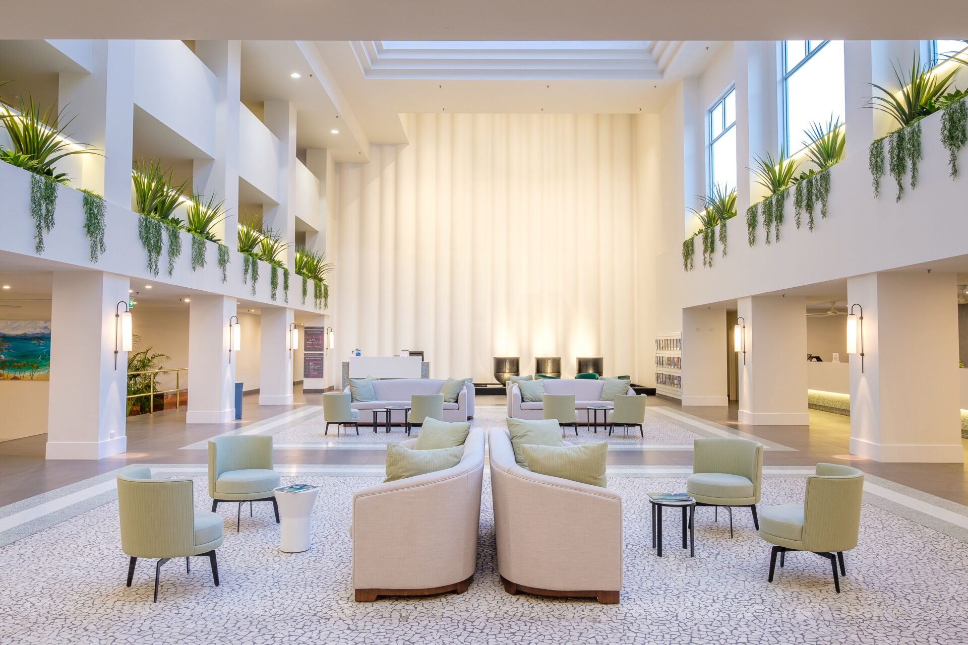 Corian curtain wall in white lobby space