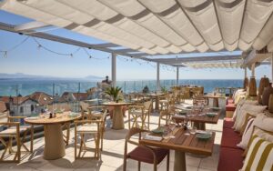 roof terrace with sea view under white shade cloth at Talaia Hotel Spa Biarritz