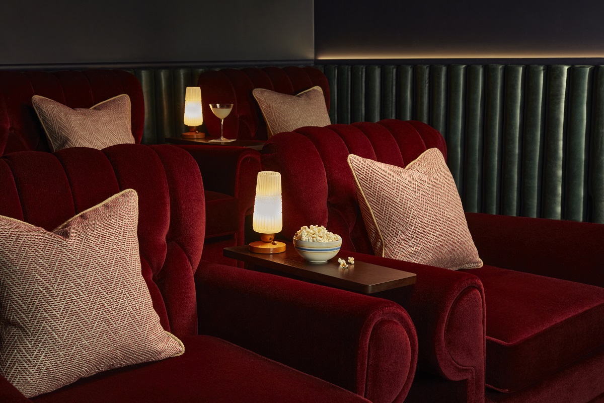 comfy chairs, lanterns, cushions and popcorn in screening room The hoxton