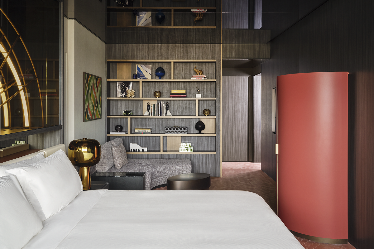 white linen, dark grey walls and wood surfaces in guestroom at W florence