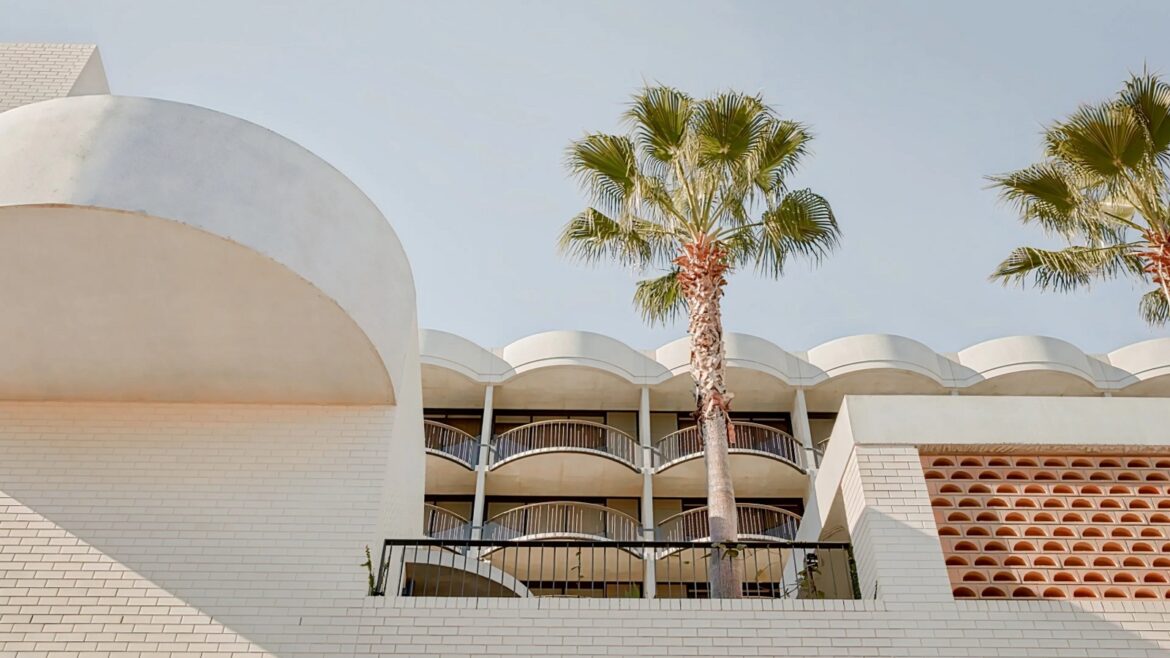 palm trees and facade The Calile Hotel Australia