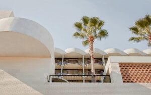 palm trees and facade The Calile Hotel Australia