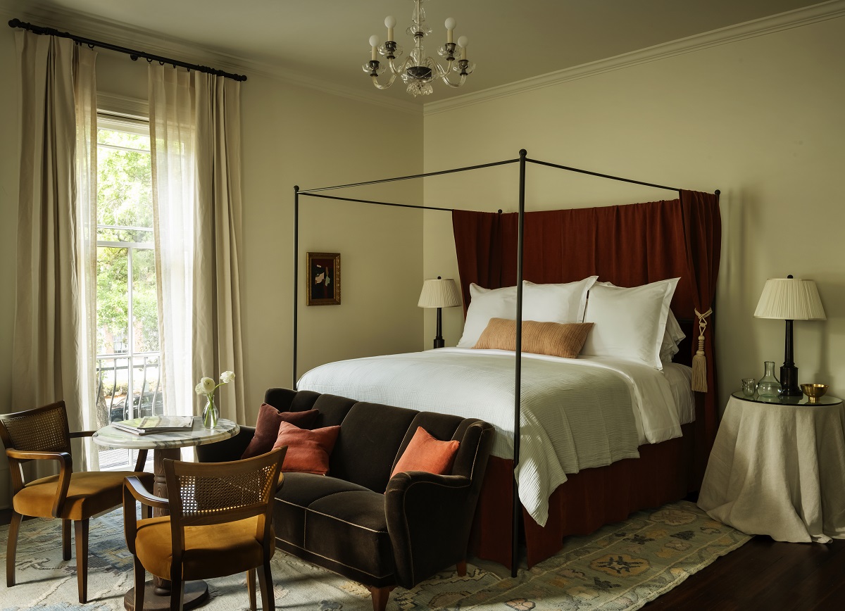 guestroom with four-poster bed and period details in The Douglas