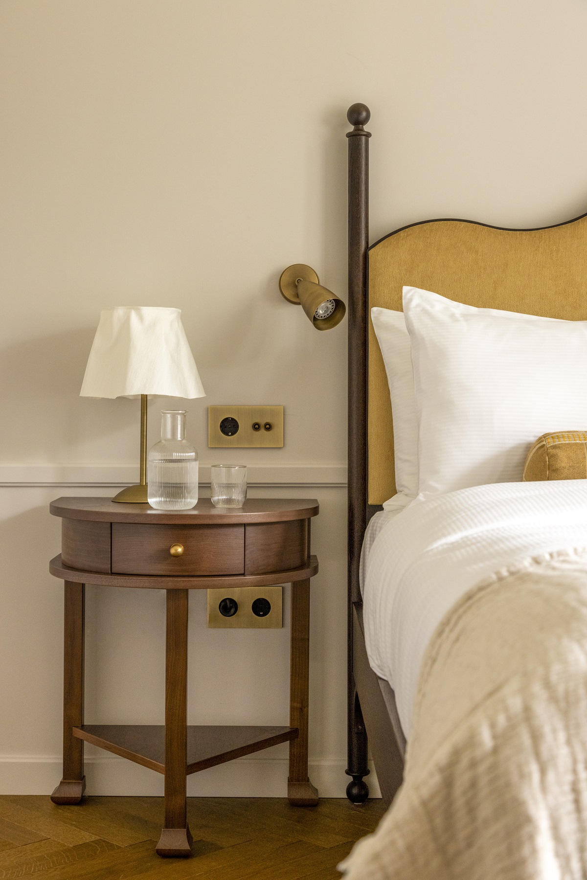 bed and bedside table detail in guestroom Miiro Palais Rudolf