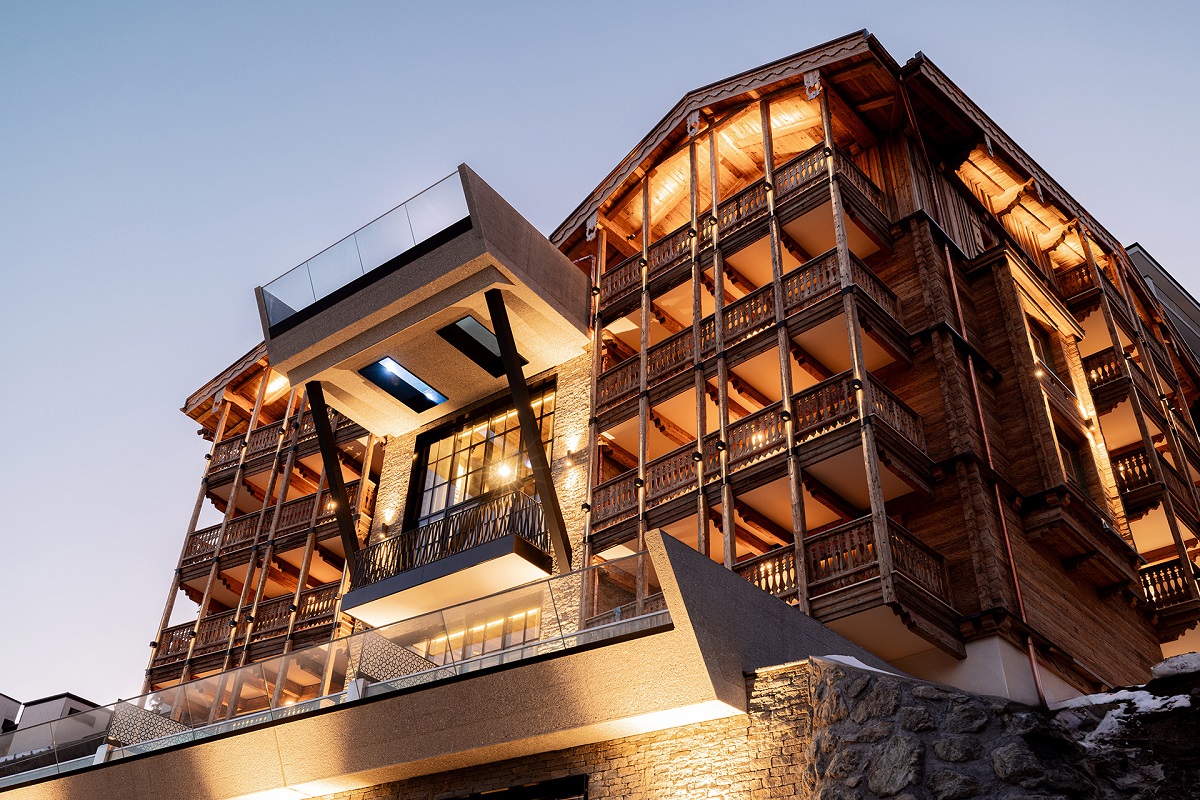 evening facade at BelArosa with view looking up through cantilevered pool