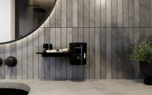 Flaky soap grinder and dispenser by ALISEO, in black on grey tile background