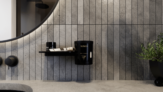 Flaky soap grinder and dispenser by ALISEO, in black on grey tile background