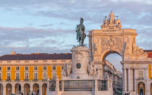 Praça do Comercio, stone archway decorated in carved figures.