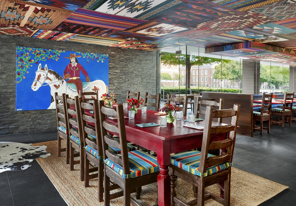 tex-mex inspired design with painted ceiling and art on the wall inLos Charros smokehouse Dallas