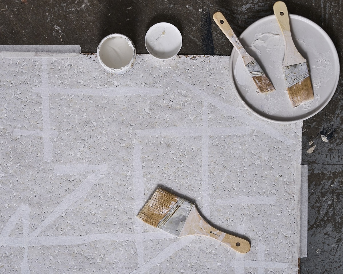masking tape, paper, paint and brushes in an inspirational moodboard for the Harlequin SW25 collection