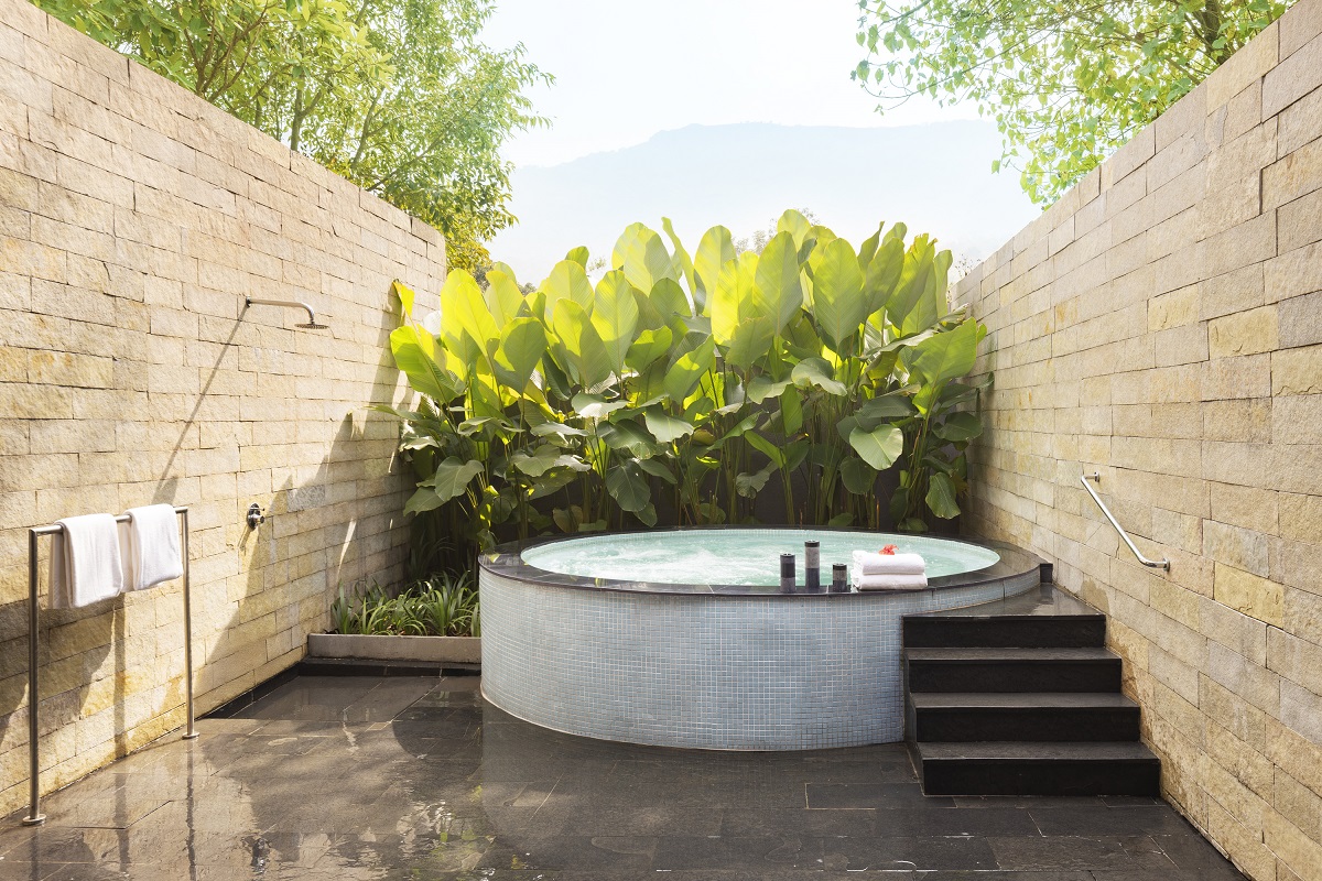 plunge pool in courtyard with tropical foliage