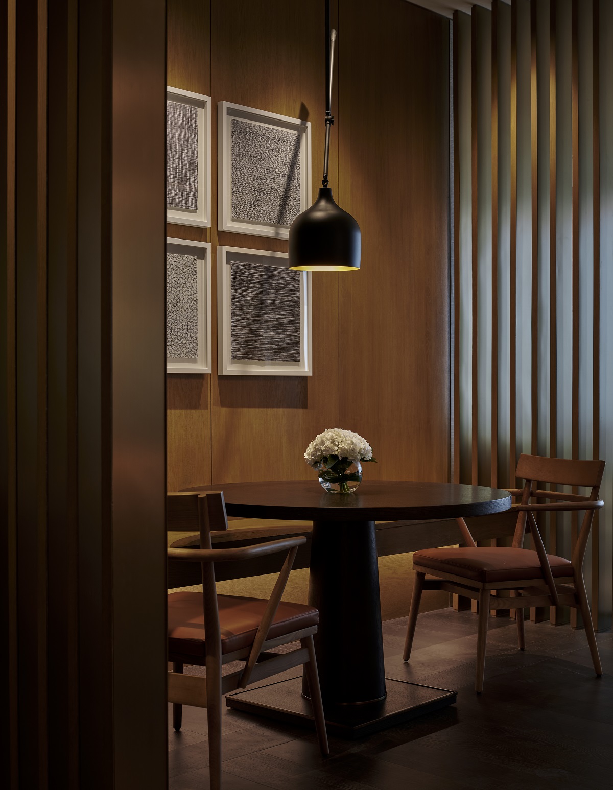 interior design detail with dining table and chairs in hotel suite corner