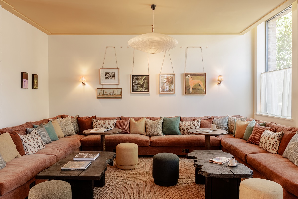 banquette style seating in the hotel lobby with gallery wall