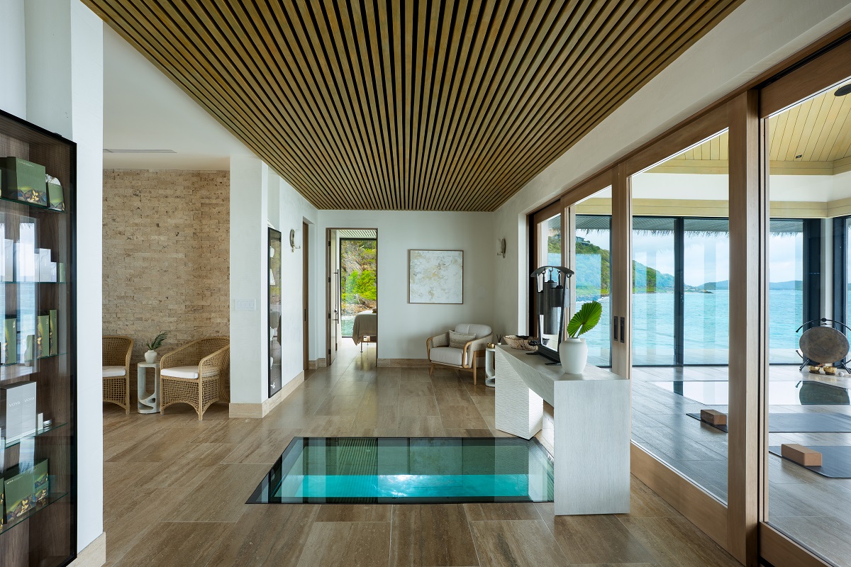interior of the overwater spa with view into ocean below
