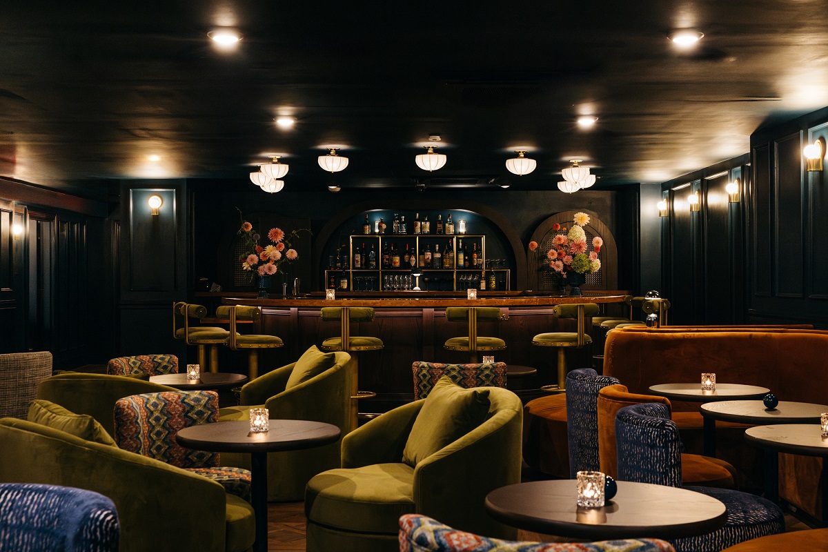 dark ceiling and walls and low lighting in May Peel bar in the hotel