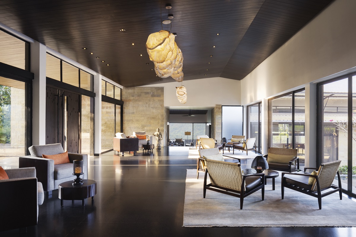 seating below textured sculptural lighting in lobby at Dharana at Shillim