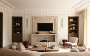 curved couch facing period fireplace in Parisian apartment decorated in neutral tones