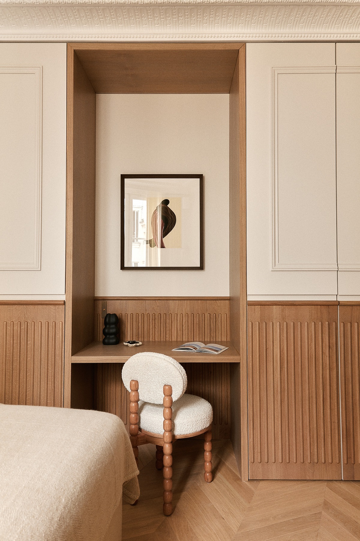 contemporary wooden panelling below period details in paris apartment