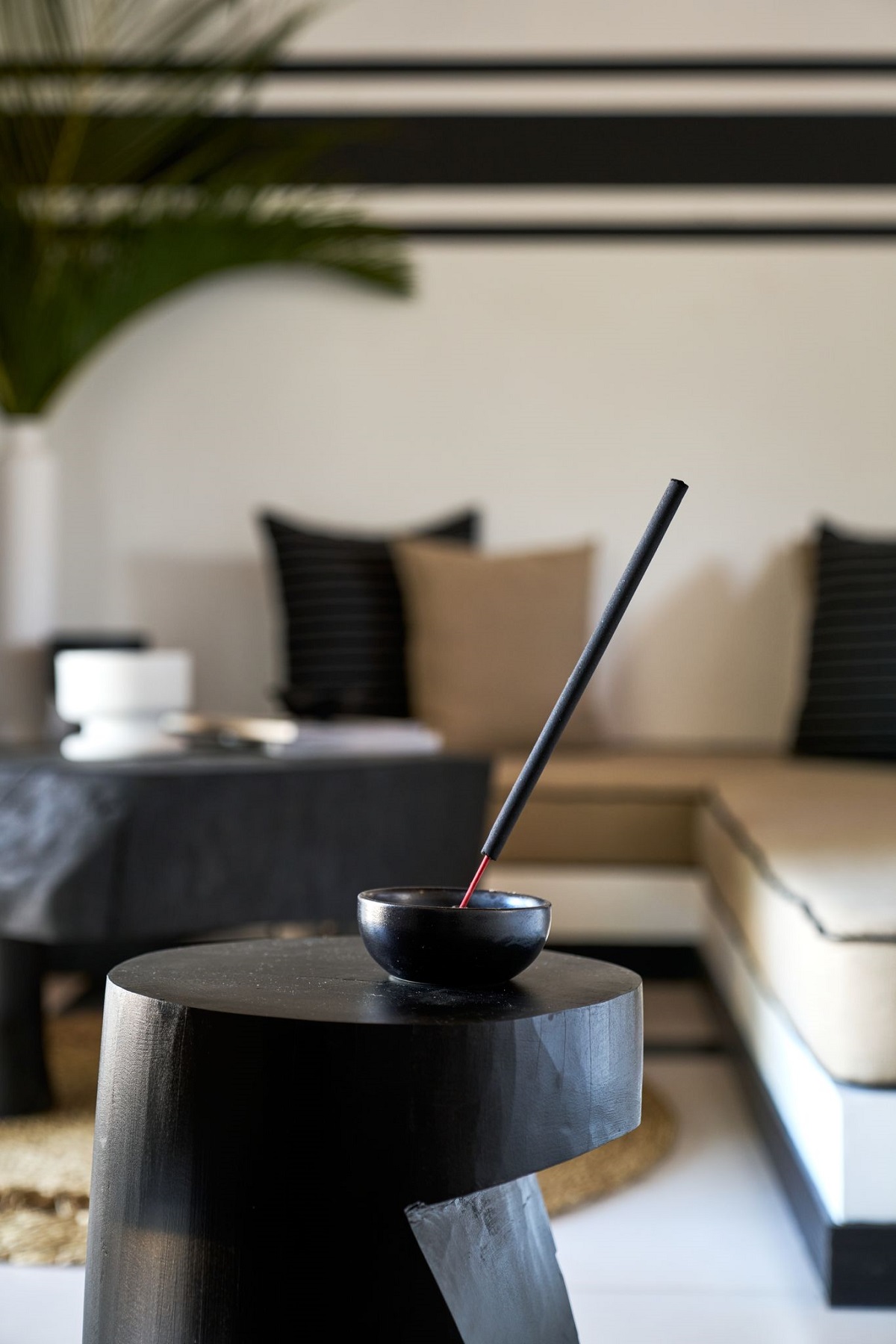hand carved wooden table and incense in hotel guestroom Sri Lanka