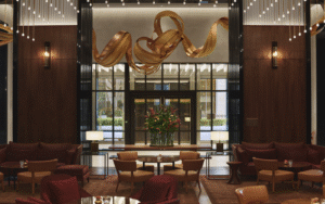entrance and lobby space in Park Hyatt London River Thames with suspended gold sculpture