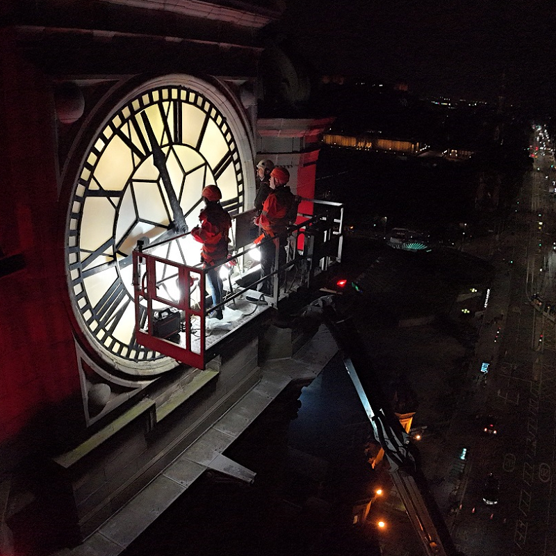 inspection of Balmoral Hotel clock tower at night