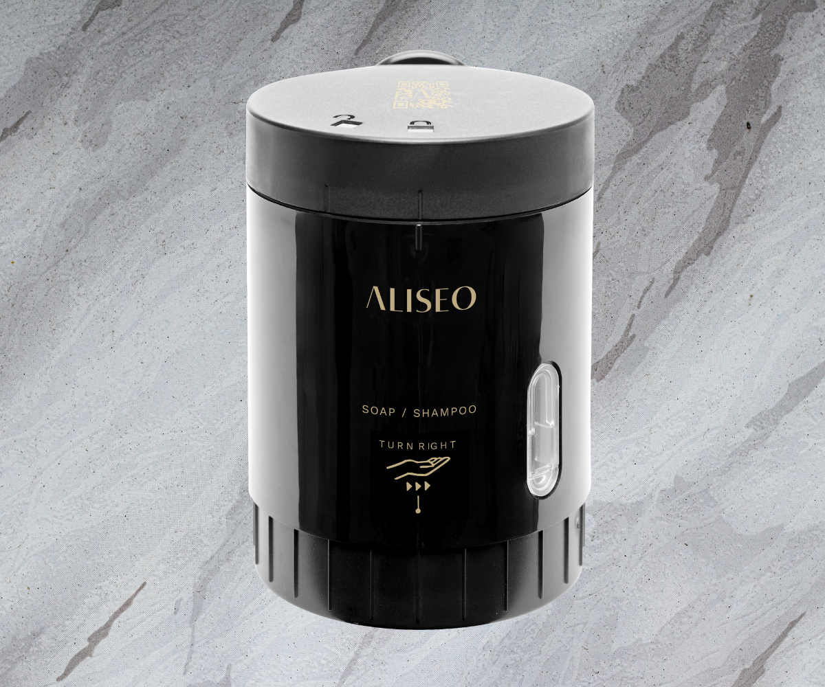 ALISEO black FLAKY soap grinder and dispenser, set on grey marble backdrop