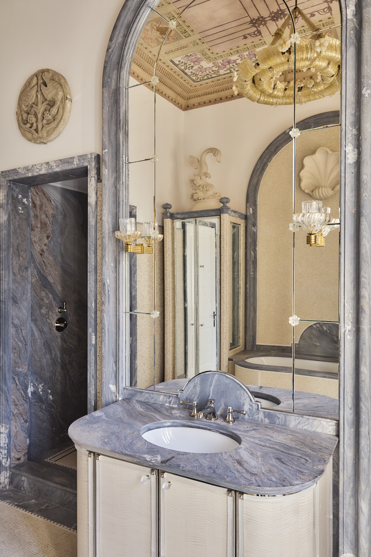 marble and gilt period details in villa bathroom