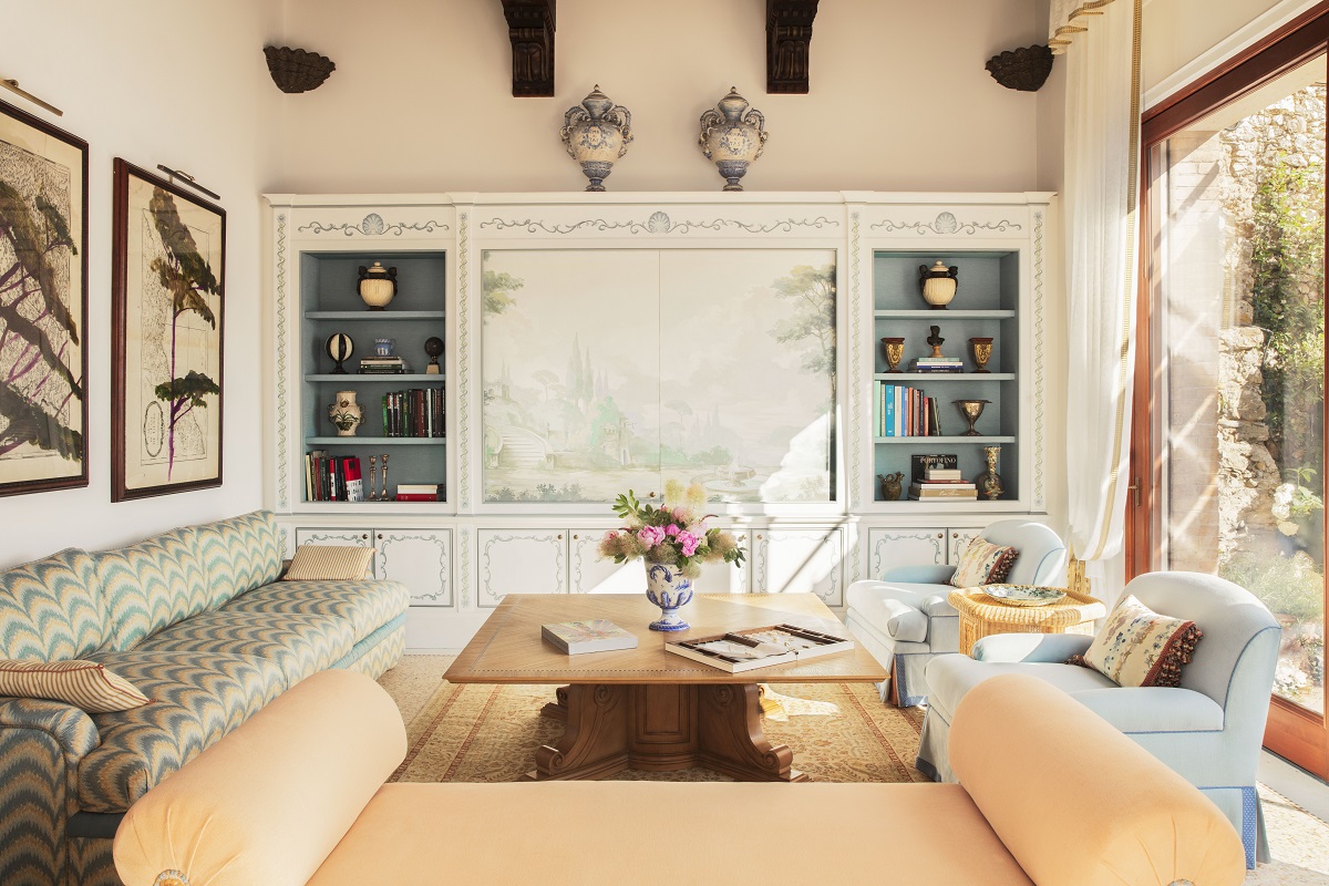 pale terracotta and powder blue furniture in lounge of Villa Beatrice