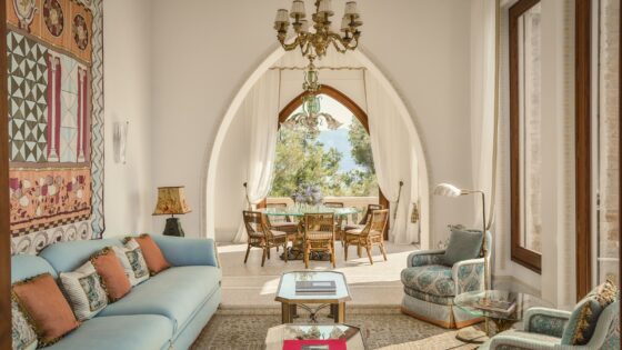 view from seating, through arches to diningroom and views beyond in Villa Beatrice, Hotel Splendido