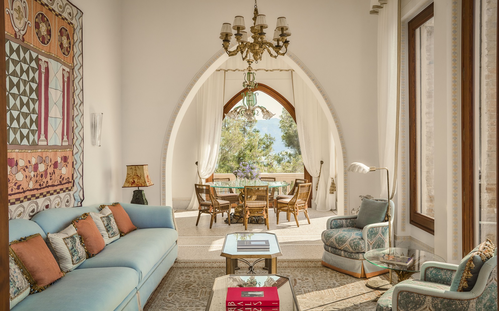 view from seating, through arches to diningroom and views beyond in Villa Beatrice, Hotel Splendido